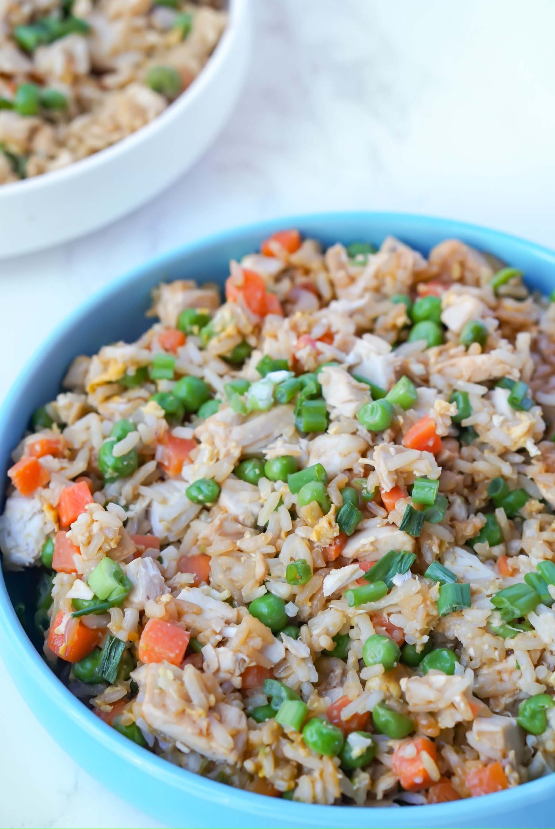 Chicken Fried Rice Recipe from Love Fitness Apparel x Alyssa Marie. Fried Rice includes rice, carrots, peas, and chicken.