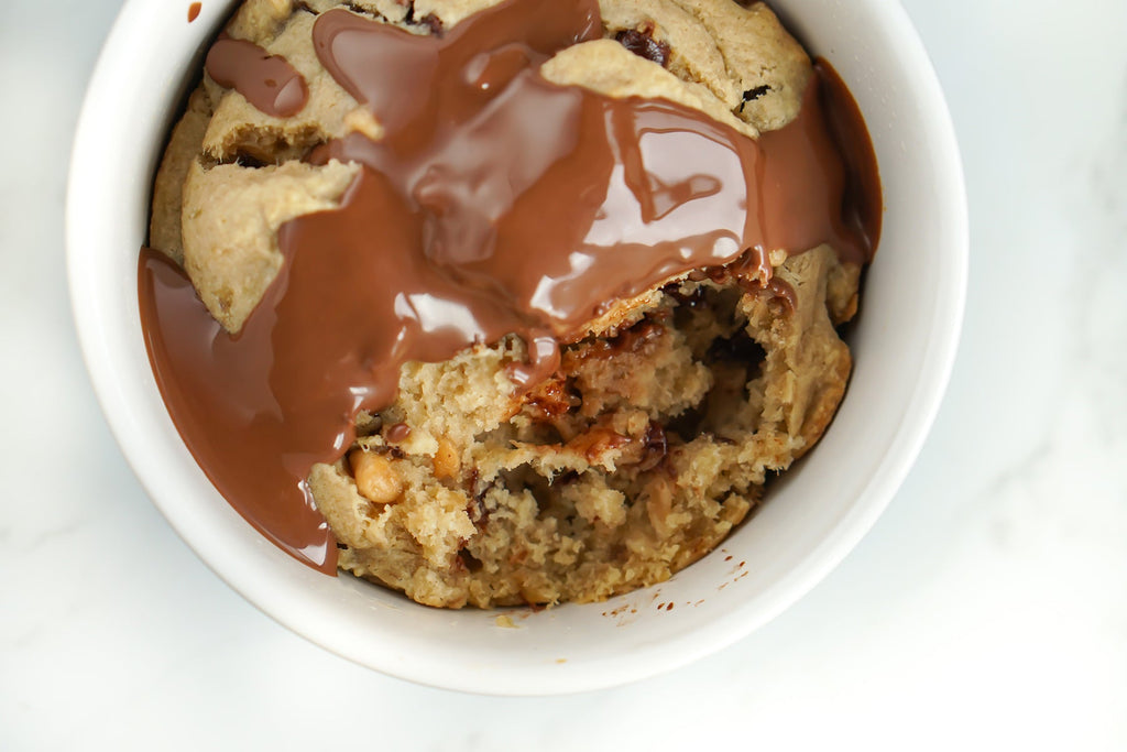Love Fitness Banana Bread Chocolate chip muffin recipe photo with peanut butter chocolate drizzle on top.