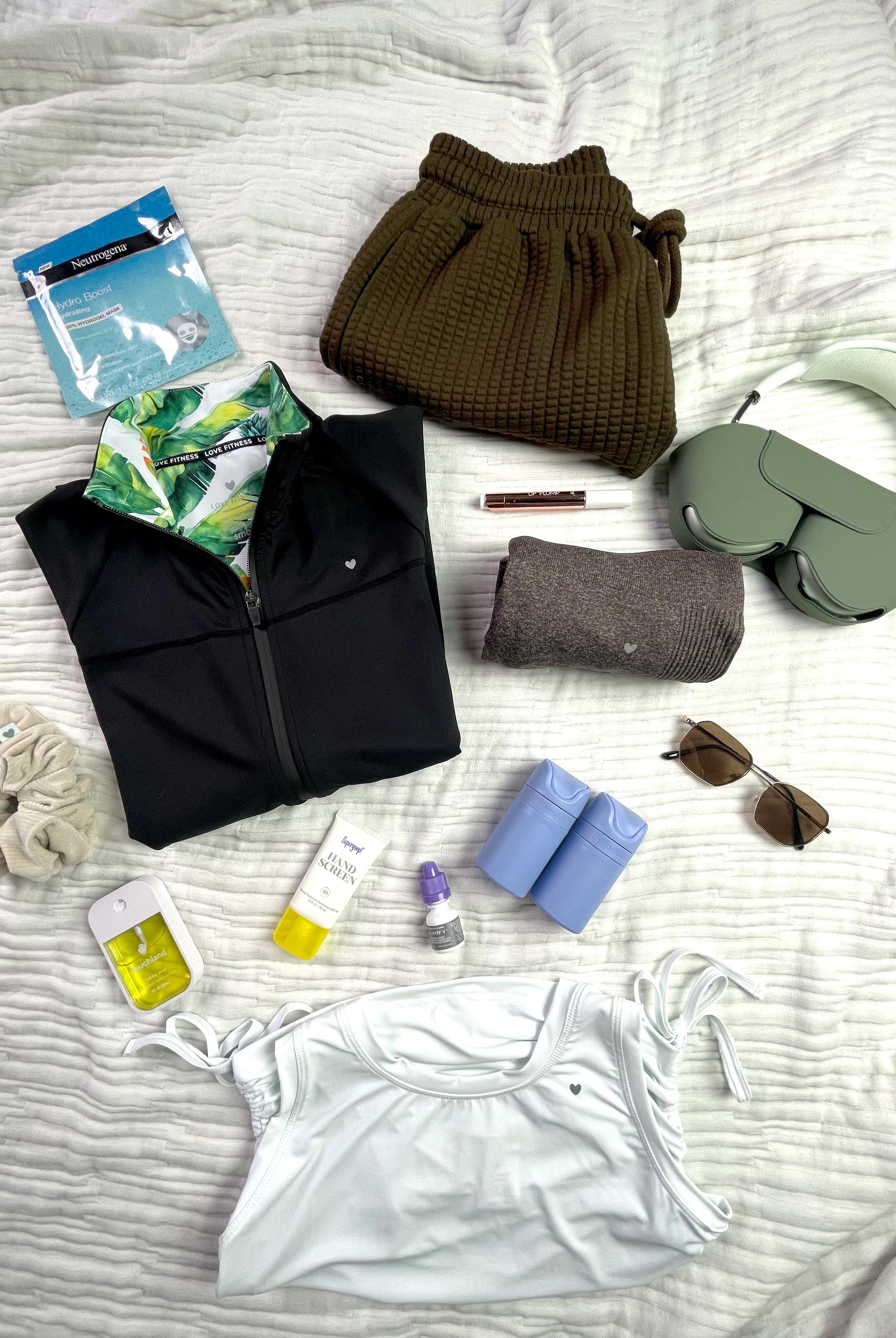 Image features essential Love Fitness items to pack on your next vacation.