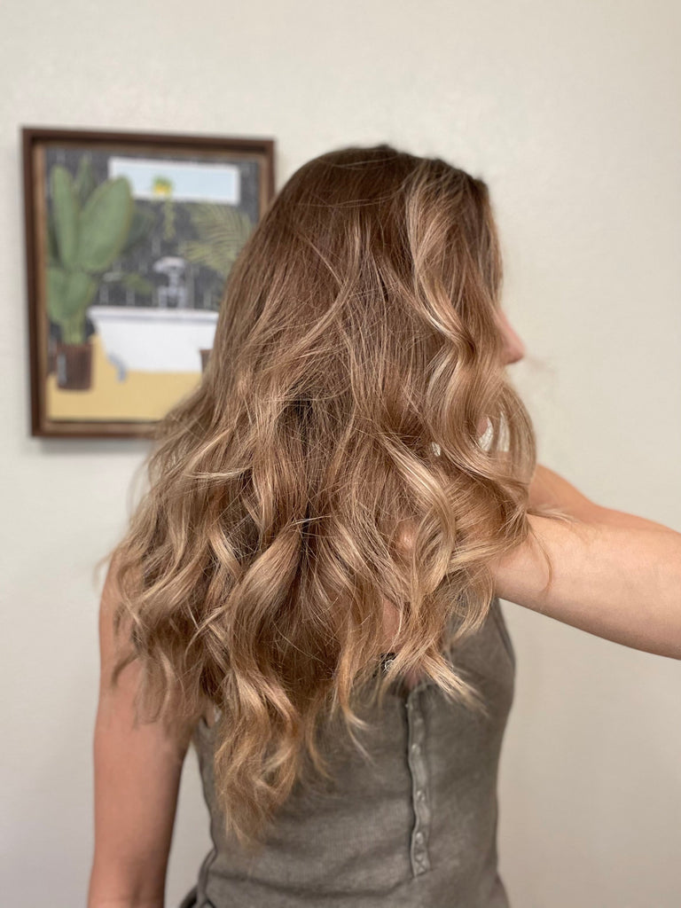 Hair curls after curled with Love Fitness leggings.