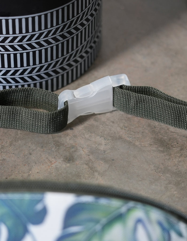Beautiful clear hardware detailing on the clasp for the adjustable straps on the Love Fitness fanny pack with Monstera all over print