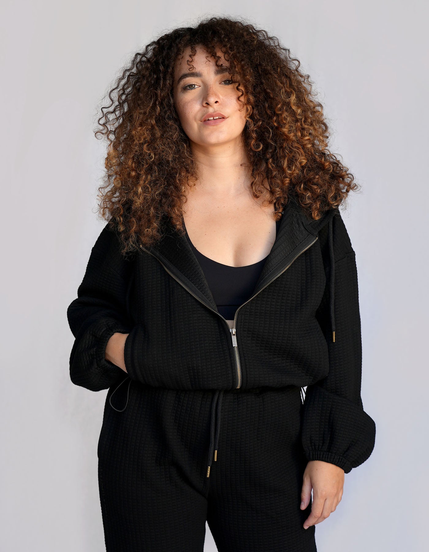 Love Fitness Phaedra Joggers in the color black. Waffle texture with pockets and drawstring to adjust the waistband.