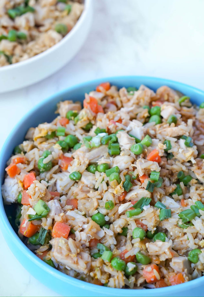 Chicken Fried Rice Recipe from Love Fitness Apparel x Alyssa Marie. Fried Rice includes rice, carrots, peas, and chicken.
