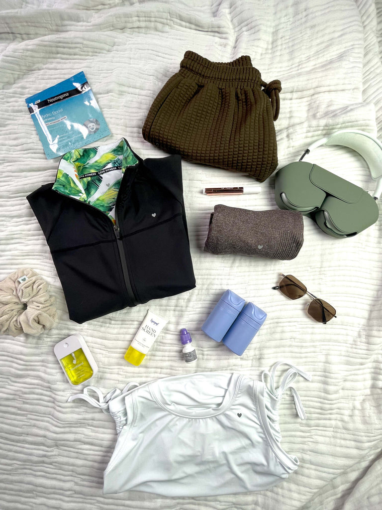 Image features essential Love Fitness items to pack on your next vacation.
