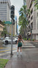 Love Fitness Dreamy Jumpsuit in the color evergreen. Model dancing on the side walk in downtown honolulu.