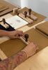 Love Fitness behind the scenes of owner stamping packaging with Love Fitness branding to share the love and thought into our customer experience.
