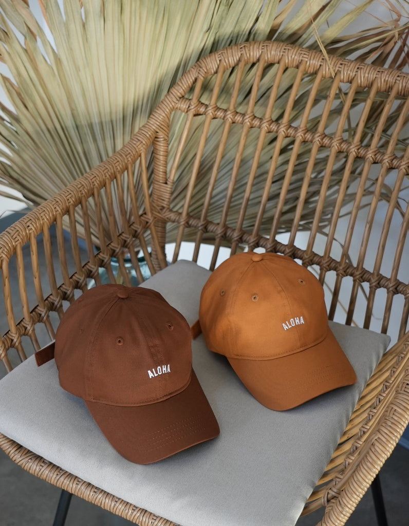 Aloha Dad Hat in burnt orange next to brown to color compare