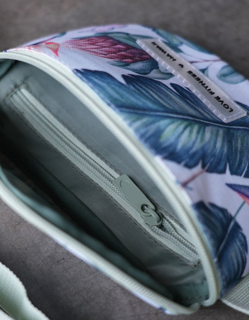 Large Zipper pocket compartment on the Love Fitness Tropical Fanny pack and a smaller zipper compartment inside the main bag.