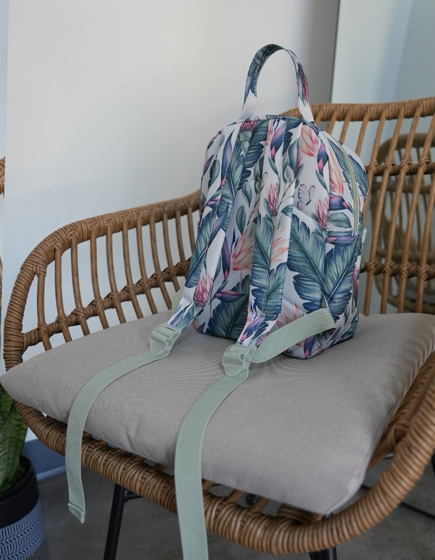 Picture of the back of the Love Fitness mini back pack with the Tropical Paradise print all over including the straps