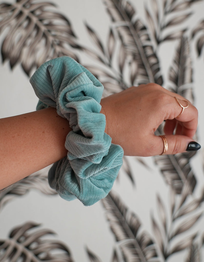 Velvet ribbed oversized scrunchie on a wrist to show the beautiful over sized look. perfect to wrap around hair twice